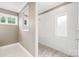 Modern bathroom featuring mosaic tile, a walk-in shower, and natural light at 705 Brown Creek Dr, Matthews, NC 28104