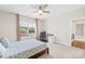 Bright bedroom features a patterned comforter, large window, and desk area with ample light at 705 Brown Creek Dr, Matthews, NC 28104