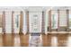 Bright foyer with hardwood floors and a decorative glass front door at 705 Brown Creek Dr, Matthews, NC 28104