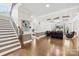 Inviting home foyer featuring a staircase, and an entryway into a living room at 705 Brown Creek Dr, Matthews, NC 28104