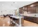 Well-lit kitchen showcases a spacious island with bar seating, stylish pendants, and modern appliances at 705 Brown Creek Dr, Matthews, NC 28104