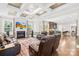 Spacious living room open to the kitchen featuring a fireplace and comfortable seating at 705 Brown Creek Dr, Matthews, NC 28104