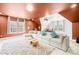 Large bonus room with a projection screen, a sectional sofa, and ample natural light at 705 Brown Creek Dr, Matthews, NC 28104