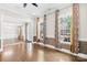 Open-concept living room featuring large windows, hardwood floors, and elegant decor at 705 Brown Creek Dr, Matthews, NC 28104