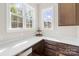Bright pantry area with ample counter space, drawers and natural light streaming through two windows at 705 Brown Creek Dr, Matthews, NC 28104
