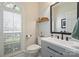 Tastefully updated bathroom with modern fixtures, vanity, and natural light at 7117 Chadwyck Farms Dr, Charlotte, NC 28226
