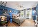 Comfortable bedroom with wood flooring, fan, large windows, and plenty of natural light at 7117 Chadwyck Farms Dr, Charlotte, NC 28226