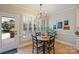 Charming breakfast nook featuring a round table, hardwood floors, and natural light at 7117 Chadwyck Farms Dr, Charlotte, NC 28226