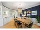 Spacious dining room featuring hardwood floors, natural light, and tasteful décor at 7117 Chadwyck Farms Dr, Charlotte, NC 28226