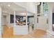 Elegant foyer featuring hardwood floors, white columns, and high ceilings with a view to the dining room at 7117 Chadwyck Farms Dr, Charlotte, NC 28226