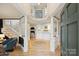 Bright foyer featuring hardwood floors, white columns, and open access to the living spaces at 7117 Chadwyck Farms Dr, Charlotte, NC 28226