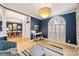 Open living room showcasing the window with shutter, hardwood floor, and natural light at 7117 Chadwyck Farms Dr, Charlotte, NC 28226