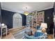 Cozy living room with a large window, built-in bookshelves, and comfortable seating at 7117 Chadwyck Farms Dr, Charlotte, NC 28226