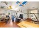 Bright and inviting living room with wood floors, built-in shelving, and modern lighting fixtures at 7117 Chadwyck Farms Dr, Charlotte, NC 28226