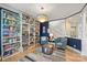 Bright living room offering built in bookcases, chair rail, and natural light at 7117 Chadwyck Farms Dr, Charlotte, NC 28226