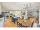 Bright, open floorplan with modern kitchen, dining area, living room, and hardwood floors at 7117 Chadwyck Farms Dr, Charlotte, NC 28226