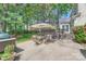 Backyard patio with dining and grilling area plus views of the yard at 7316 Versailles Ln, Charlotte, NC 28277