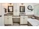 Bathroom with dual vanities, granite countertops, and a soaking tub for ultimate relaxation at 7316 Versailles Ln, Charlotte, NC 28277