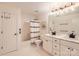 Neutral bathroom boasting double vanity, marble countertops and shower with modern fixtures at 7316 Versailles Ln, Charlotte, NC 28277