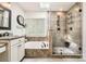 Bright bathroom featuring a walk-in shower, soaking tub, and granite countertops for a luxurious experience at 7316 Versailles Ln, Charlotte, NC 28277