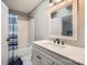 Clean bathroom with shower and tub combination, updated vanity, and neutral wall color at 7316 Versailles Ln, Charlotte, NC 28277