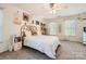 Bright bedroom featuring neutral walls, soft carpet, and a boho-chic headboard at 7316 Versailles Ln, Charlotte, NC 28277