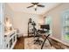 Bright home office with natural light, work station, and a ceiling fan at 7316 Versailles Ln, Charlotte, NC 28277