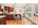 Bright eat-in kitchen with wooden cabinets, granite counters, and stainless steel appliances at 7316 Versailles Ln, Charlotte, NC 28277