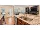 Kitchen area with stainless steel appliances, granite counters, and an eat-in bar area at 7316 Versailles Ln, Charlotte, NC 28277