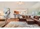 Open-concept living area with a view of the kitchen and staircase at 7316 Versailles Ln, Charlotte, NC 28277