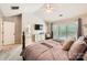 Comfortable main bedroom with a large window, neutral walls, and an en-suite bathroom entrance at 7316 Versailles Ln, Charlotte, NC 28277