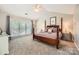 Spacious main bedroom boasts a vaulted ceiling, neutral carpeting, and an abundance of natural light at 7316 Versailles Ln, Charlotte, NC 28277