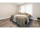 This inviting bedroom features a large window and neutral decor with attractive and durable flooring at 803 E 13Th St, Kannapolis, NC 28083