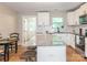 Modern kitchen featuring white cabinets, granite countertops, and stainless steel appliances at 803 E 13Th St, Kannapolis, NC 28083