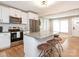 Modern kitchen featuring stainless steel appliances, white cabinets, and a granite-topped island with seating at 803 E 13Th St, Kannapolis, NC 28083