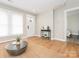 Cozy living room with hardwood floors, neutral walls, and front door access at 803 E 13Th St, Kannapolis, NC 28083