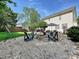 This backyard includes a fire pit with seating area and lots of room for entertaining guests at 8140 Laurel Run Dr, Charlotte, NC 28269