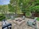 This backyard features a stone fire pit with seating area, great for outdoor gatherings at 8140 Laurel Run Dr, Charlotte, NC 28269