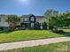 Classic home featuring a green lawn, mature trees, and manicured landscaping, offering an inviting curb appeal at 8140 Laurel Run Dr, Charlotte, NC 28269