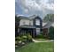 Charming two-story home with manicured lawn and vibrant landscaping, offering inviting curb appeal at 8140 Laurel Run Dr, Charlotte, NC 28269