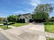 Charming home with a well-maintained lawn, mature trees, and a long driveway, creating a welcoming entrance at 8140 Laurel Run Dr, Charlotte, NC 28269