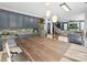 Kitchen and dining area featuring stainless steel appliances, pendant lighting, and dining table with chairs at 8140 Laurel Run Dr, Charlotte, NC 28269
