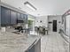 Modern kitchen with granite countertops, stainless steel appliances, and adjacent dining area at 8140 Laurel Run Dr, Charlotte, NC 28269