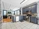 Well-equipped kitchen with stainless steel appliances, stone backsplash, and an open view of the living area at 8140 Laurel Run Dr, Charlotte, NC 28269