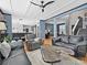 Open-concept living room showcasing hardwood floors, comfortable seating, and access to other areas of the home at 8140 Laurel Run Dr, Charlotte, NC 28269
