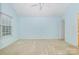 Expansive carpeted bedroom offers natural light from a large window and a ceiling fan at 942 Pelican Bay Dr, Pineville, NC 28134