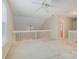 Upstairs bonus room with carpet and lots of natural light and neutral paint at 942 Pelican Bay Dr, Pineville, NC 28134