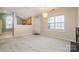 Open living space with fireplace and large window allowing natural light at 942 Pelican Bay Dr, Pineville, NC 28134
