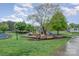Playground features various play equipment near a scenic lake with a walking path at 942 Pelican Bay Dr, Pineville, NC 28134