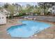 Community pool with lounge chairs and a secure fence for residents to enjoy at 942 Pelican Bay Dr, Pineville, NC 28134